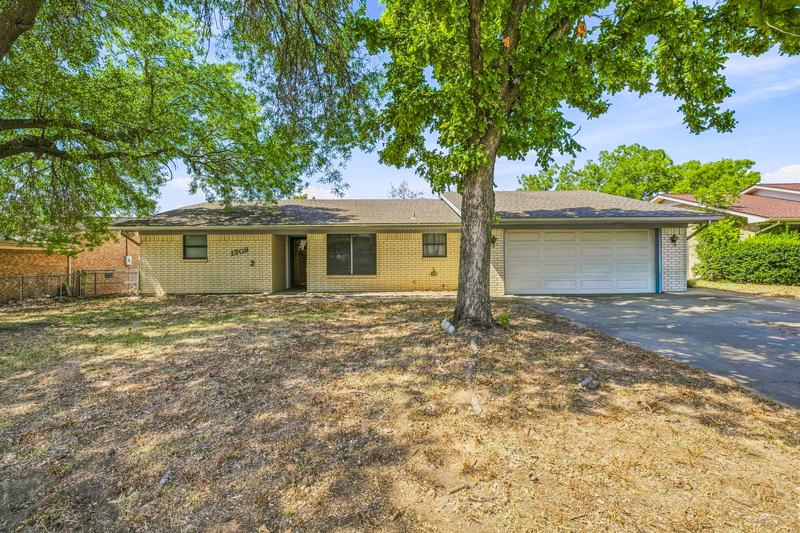 Front of the home with the two-car garage and driveway