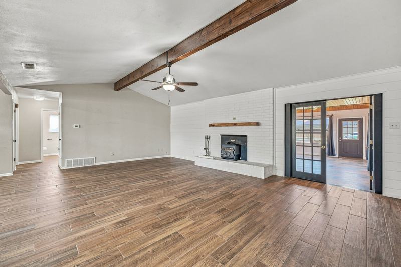 Living room with glass doors opening to the sunroom