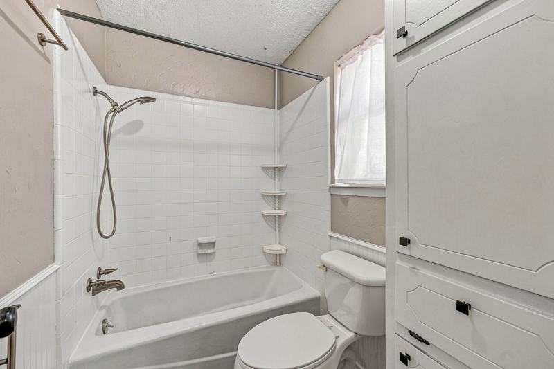 Bathroom with a tub and shower combination