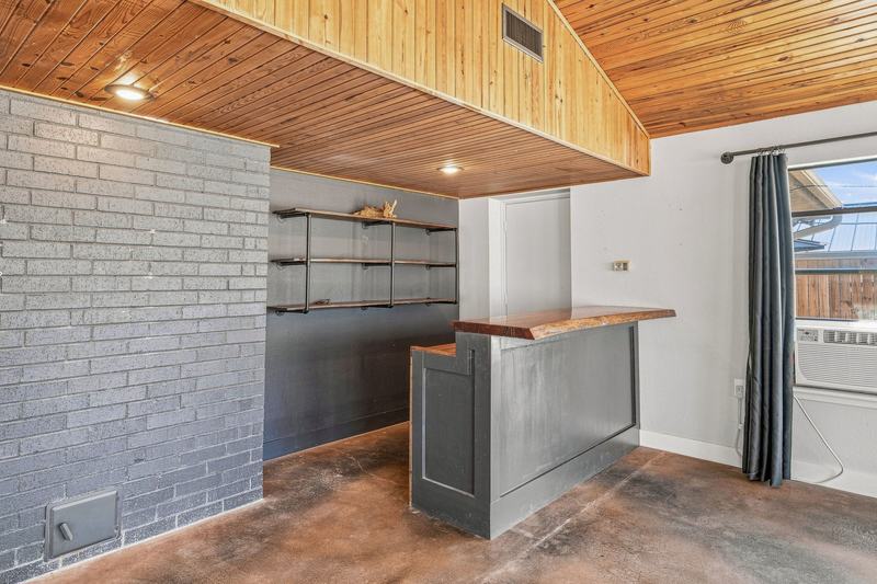 Built-in bar and shelving in the sunroom